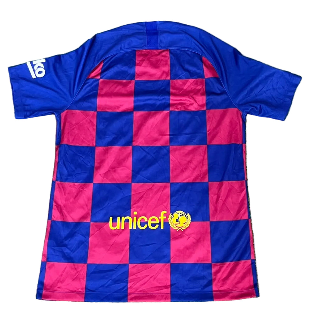 A short-sleeve soccer jersey, featuring a blue and magenta checkered pattern with a yellow 'unicef' logo on the front. The number 18 is printed in white on the right sleeve.