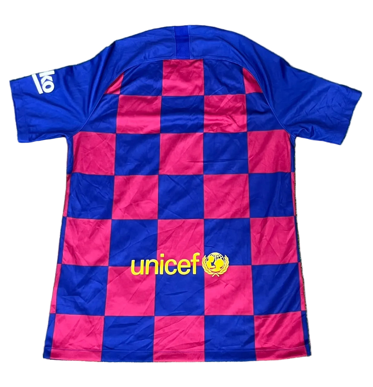 A short-sleeve soccer jersey, featuring a blue and magenta checkered pattern with a yellow 'unicef' logo on the front. The number 18 is printed in white on the right sleeve.