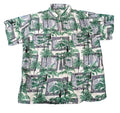 A short-sleeve button-up camp shirt with an all-over print of green palm trees