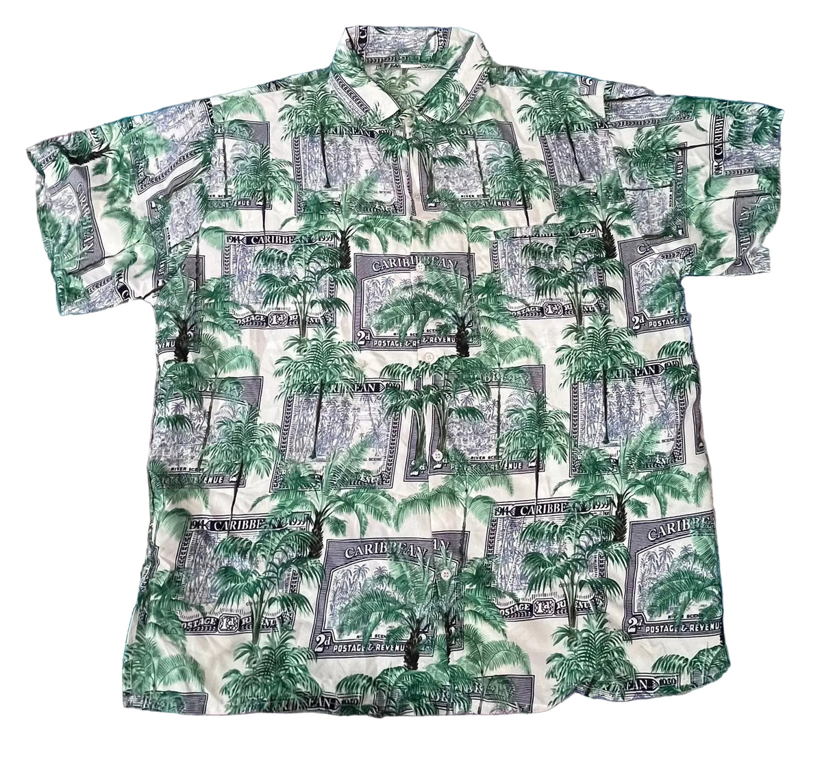 A short-sleeve button-up camp shirt with an all-over print of green palm trees
