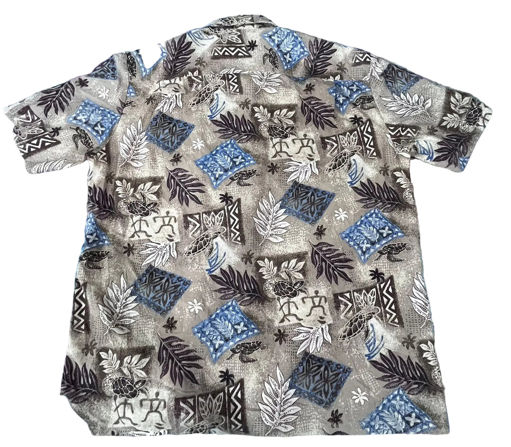 A short-sleeve button-up shirt with a complex tropical and geometric print, 