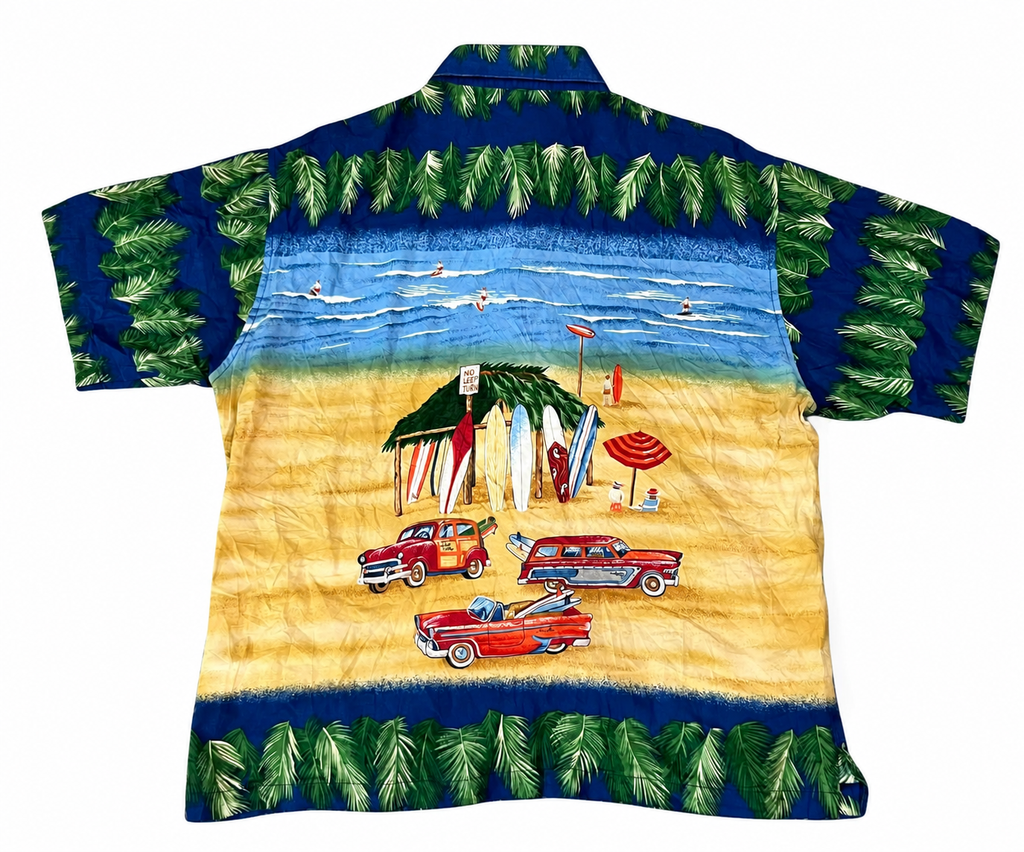 A short-sleeve button-up shirt with a colorful beach scene print. The design features a blue sky with palm trees, a sandy yellow beach, retro red cars, and beach umbrellas, framed by dark blue bands with green palm leaves at the top and bottom.