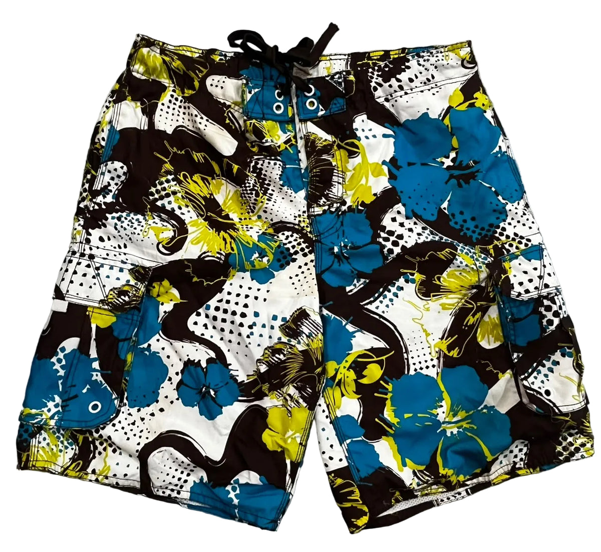 A pair of men's board shorts with a bold abstract floral print in blue, yellow, black, and white,