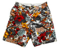 A pair of men's swim trunks featuring a busy collage print with red hibiscus flowers, yellow sunflowers, black-and-white graffiti-style murals, and vintage newspaper clippings,