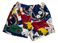 A pair of men's swim trunks featuring a colorful nautical-themed print with compasses, binoculars, a sextant, and nautical charts,