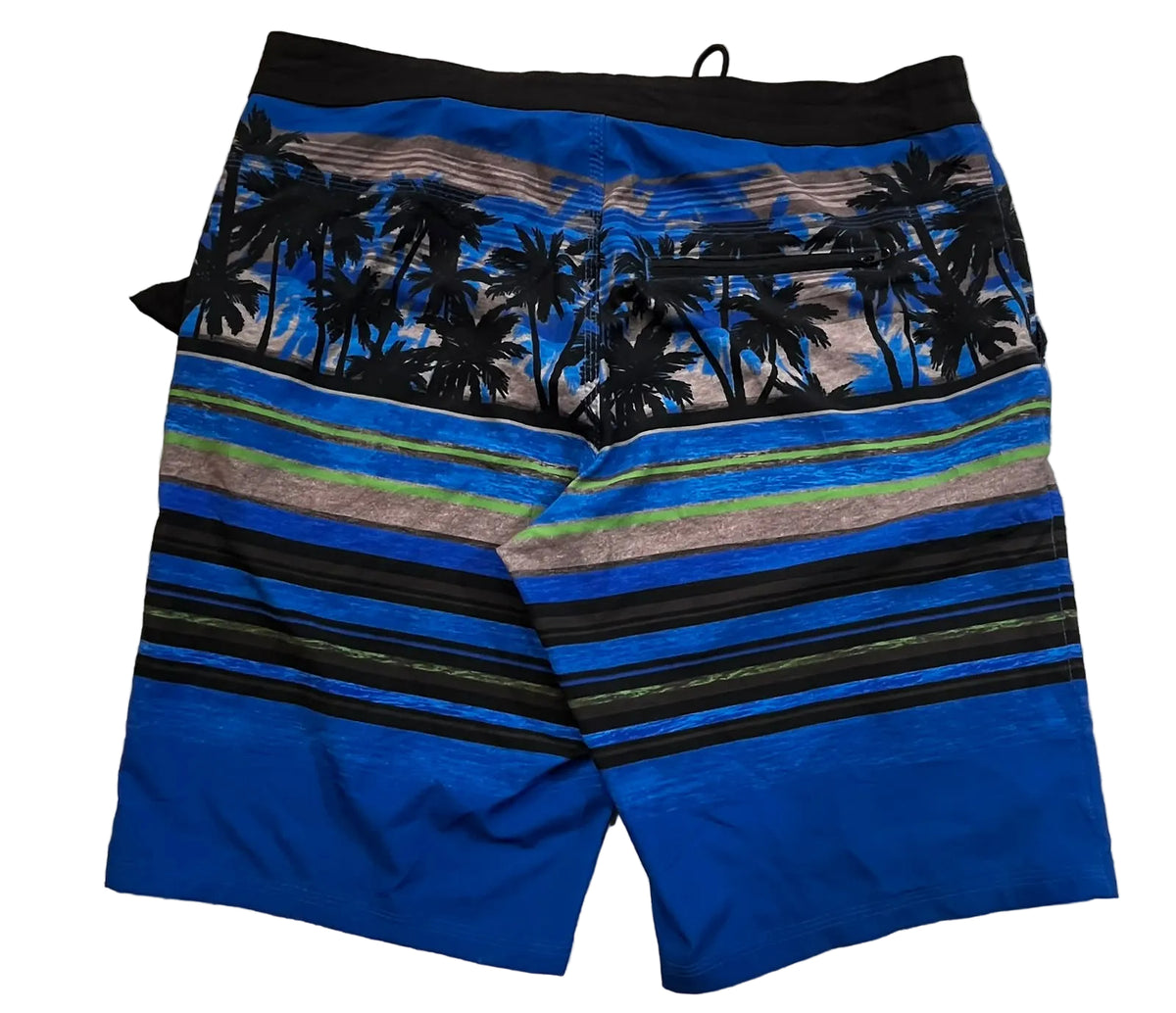 Blue tropical beach print board shorts with black palm tree silhouettes and horizontal black, green, and tan stripes, 
