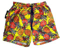 Bright yellow swim trunks with a colorful pineapple print, featuring red, orange, and green pineapples with a navy blue drawstring,