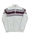 A white knit quarter-zip sweater with a red and black Nordic/Fair Isle pattern across the chest,