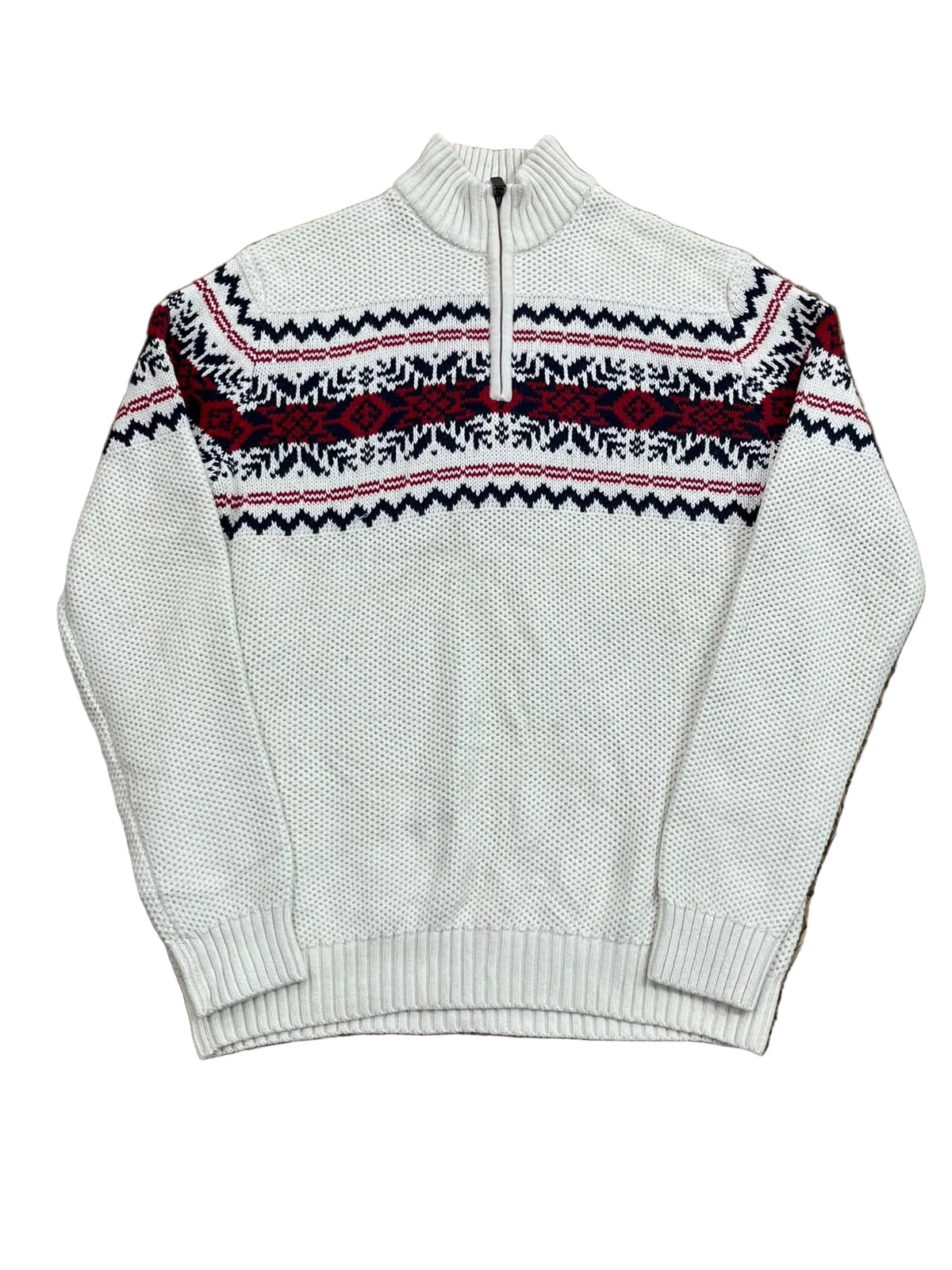 A white knit quarter-zip sweater with a red and black Nordic/Fair Isle pattern across the chest,