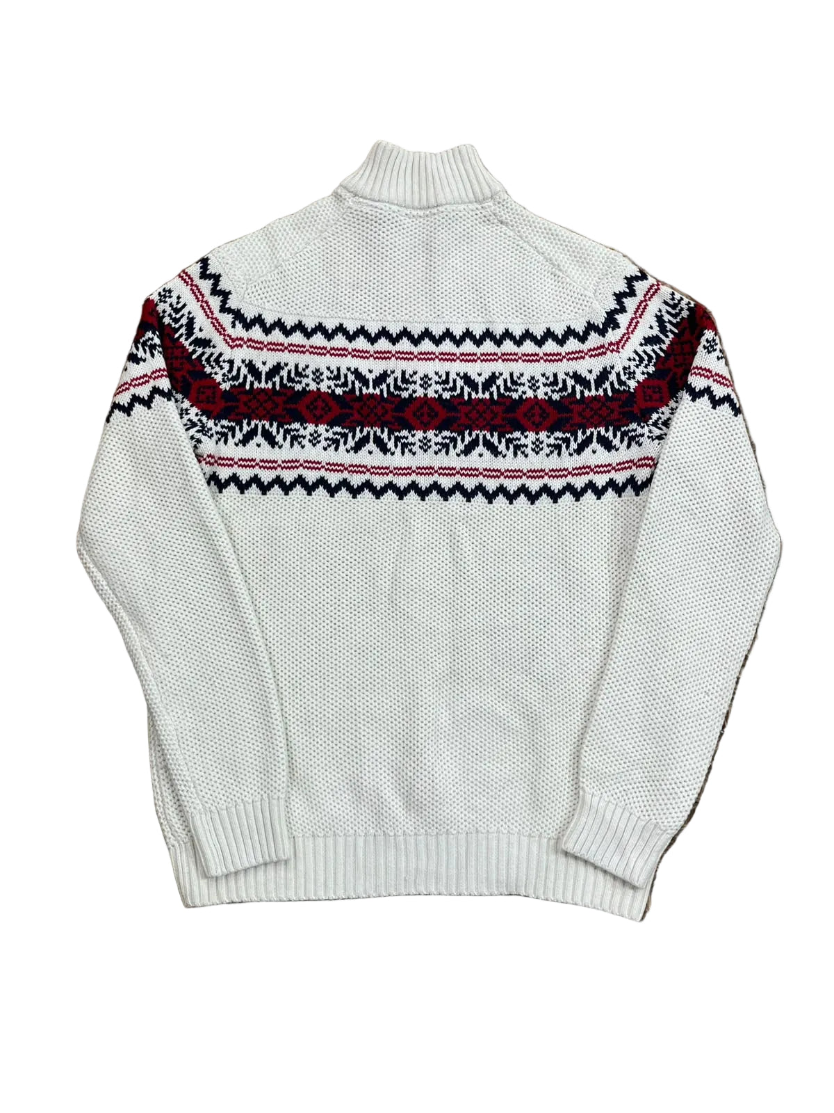 A cream-colored knit sweater with a black and red Nordic fair isle pattern across the chest,