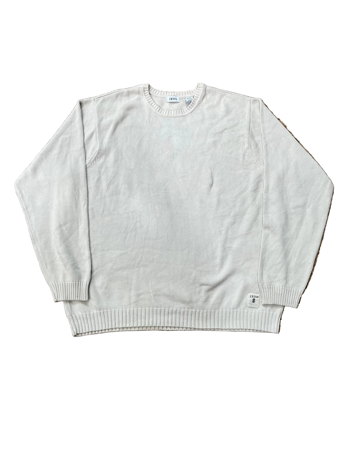 A light gray crewneck sweater with bare feet visible at the bottom edge.