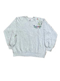 A light heather gray sweatshirt with colorful floral embroidery on the lower right chest,