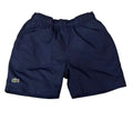 Navy blue Lacoste shorts with an elastic waistband and the signature green crocodile logo on the left leg