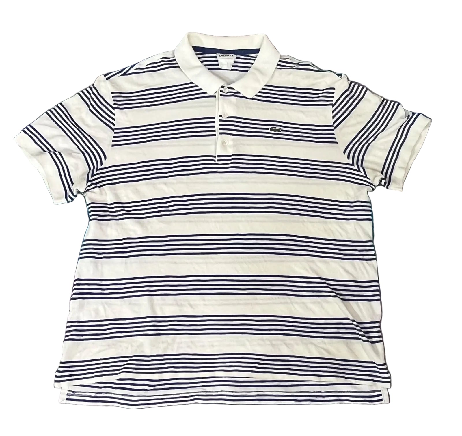 A Lacoste short-sleeve polo shirt with navy blue horizontal stripes on a white base,