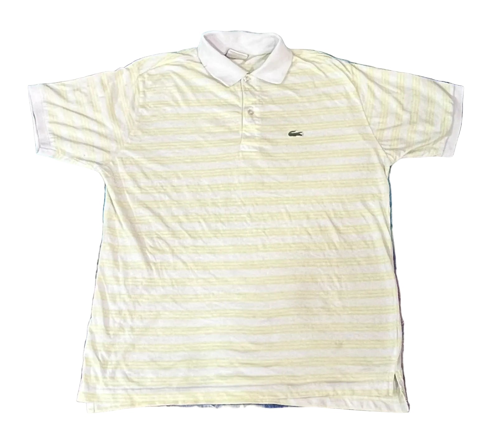 A white and pale yellow striped short-sleeve polo shirt with a white collar and a small Lacoste crocodile logo on the chest