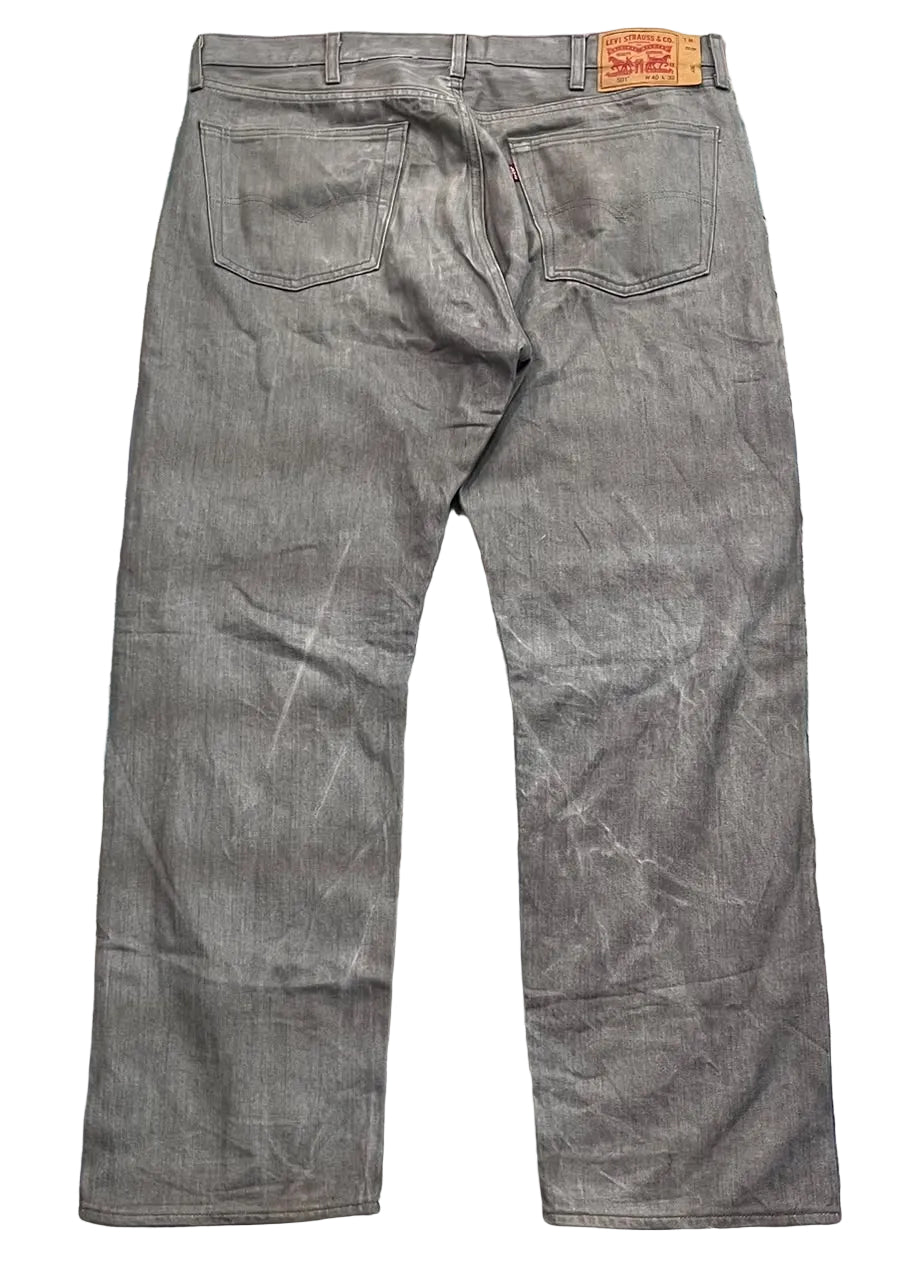 A pair of gray Levi's jeans on a white plain background