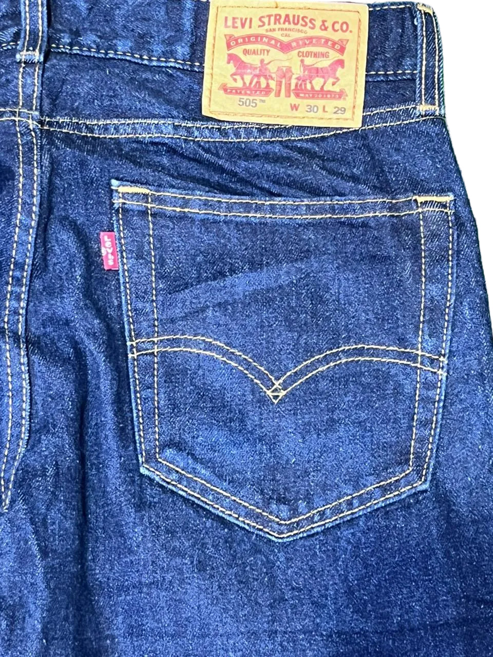 Close-up of a Levi's pocket with brand logo on a White background