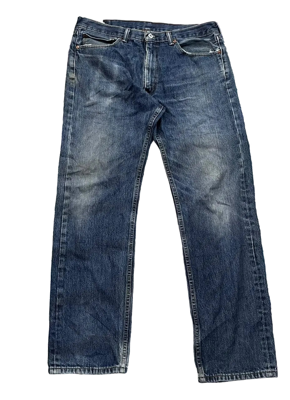 A pair of dark blue denim jeans