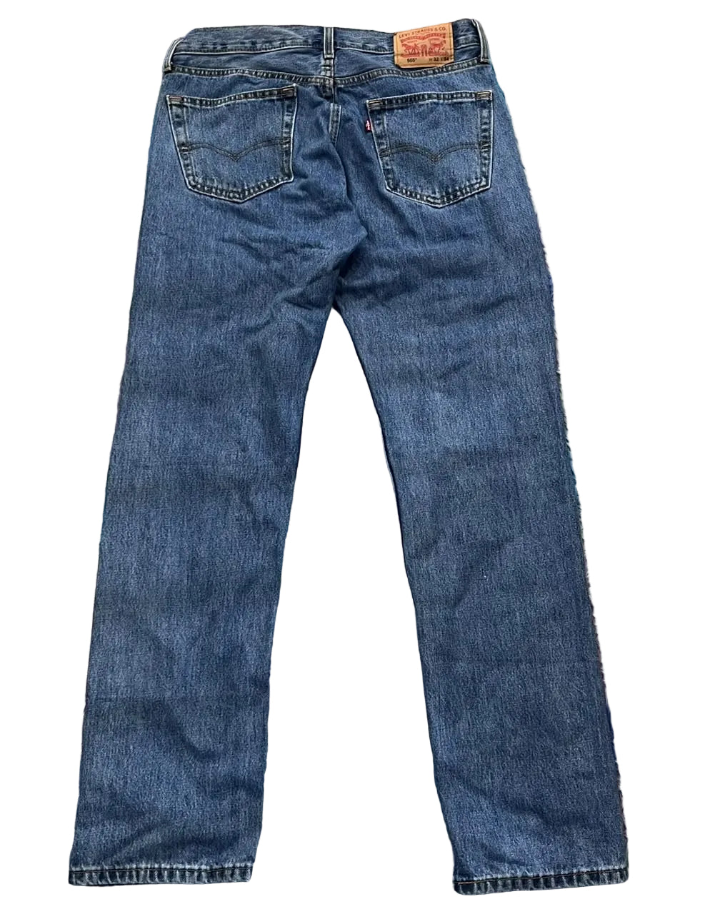 A pair of blue Levi's jeans shown from the back,
