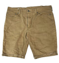 A pair of tan denim shorts ON WHITE BACKGROUND