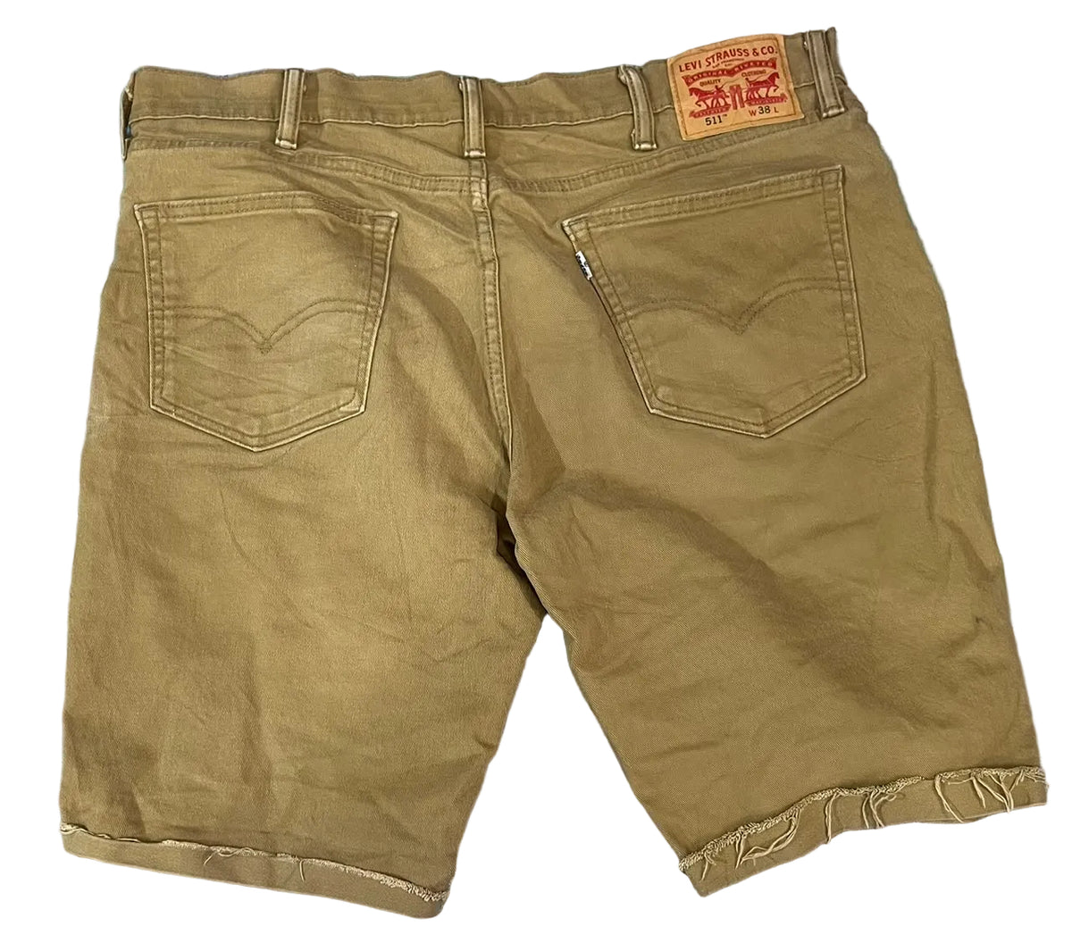 Back view of a pair of brown denim shorts , showing the iconic red Levi's waistband patch.