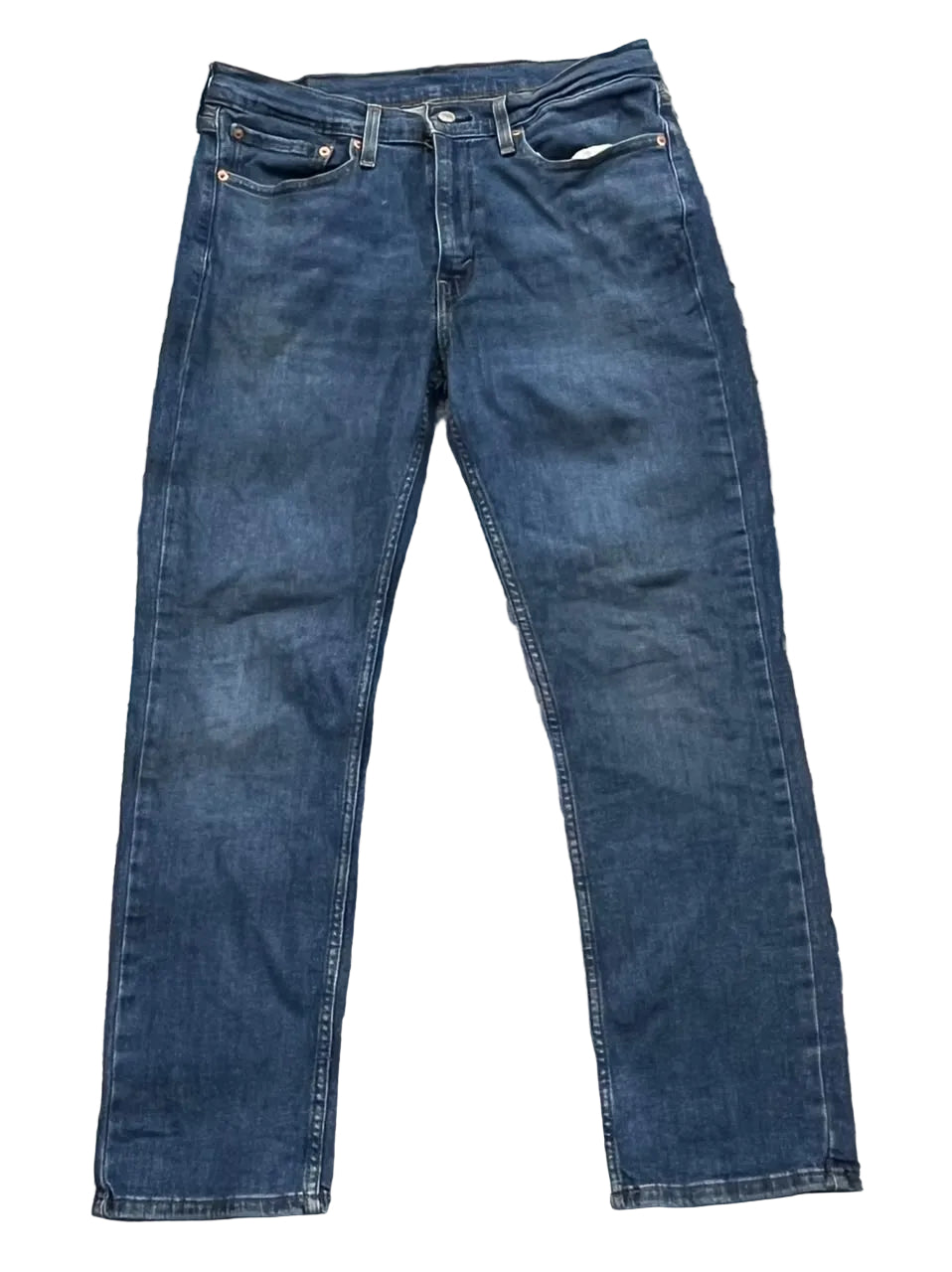 A pair of dark blue denim jeans