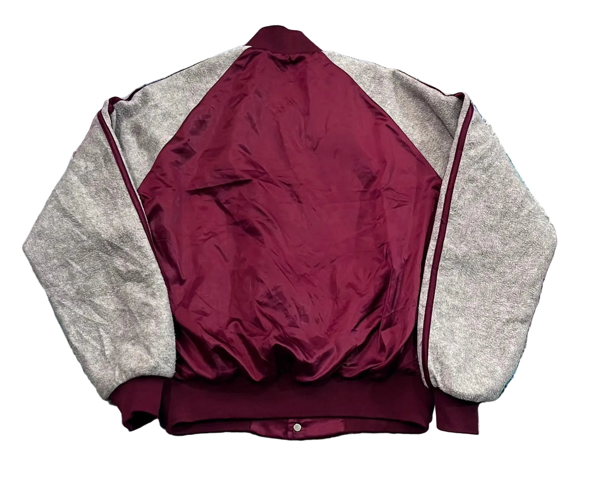 A vintage-style bomber jacket with a maroon satin body and heather gray sleeves, 