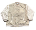 A beige and off-white varsity jacket with a large embroidered letter 'A' on the chest