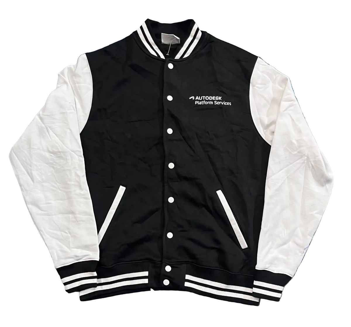A black and white varsity jacket with 'AUTODESK POWER SPORTS' embroidered on the chest