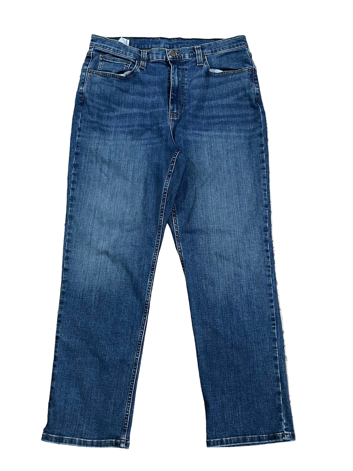 A pair of medium wash blue denim jeans ON THE WHITE BACKGROUND