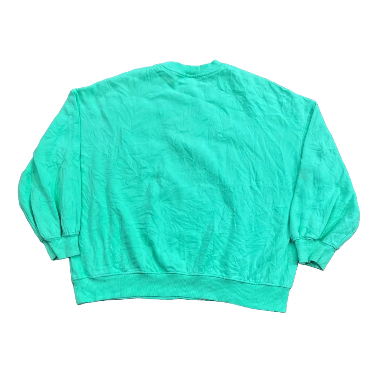 A mint green long-sleeve shirt with bare feet visible at the bottom left edge.