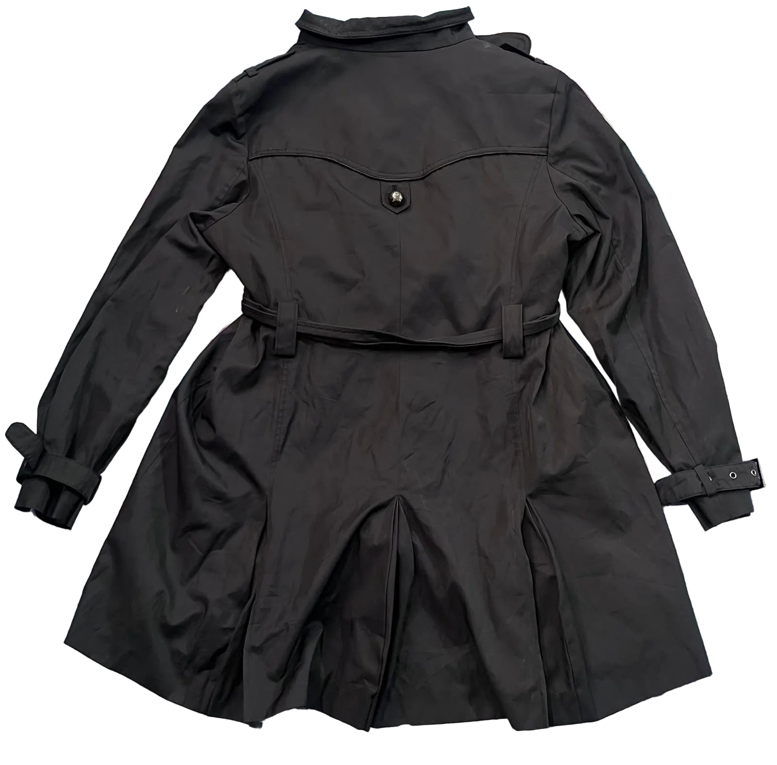 A black trench coat The back of the coat is shown, featuring a collar, a single button closure, a waist belt with loops, and buttoned cuffs.