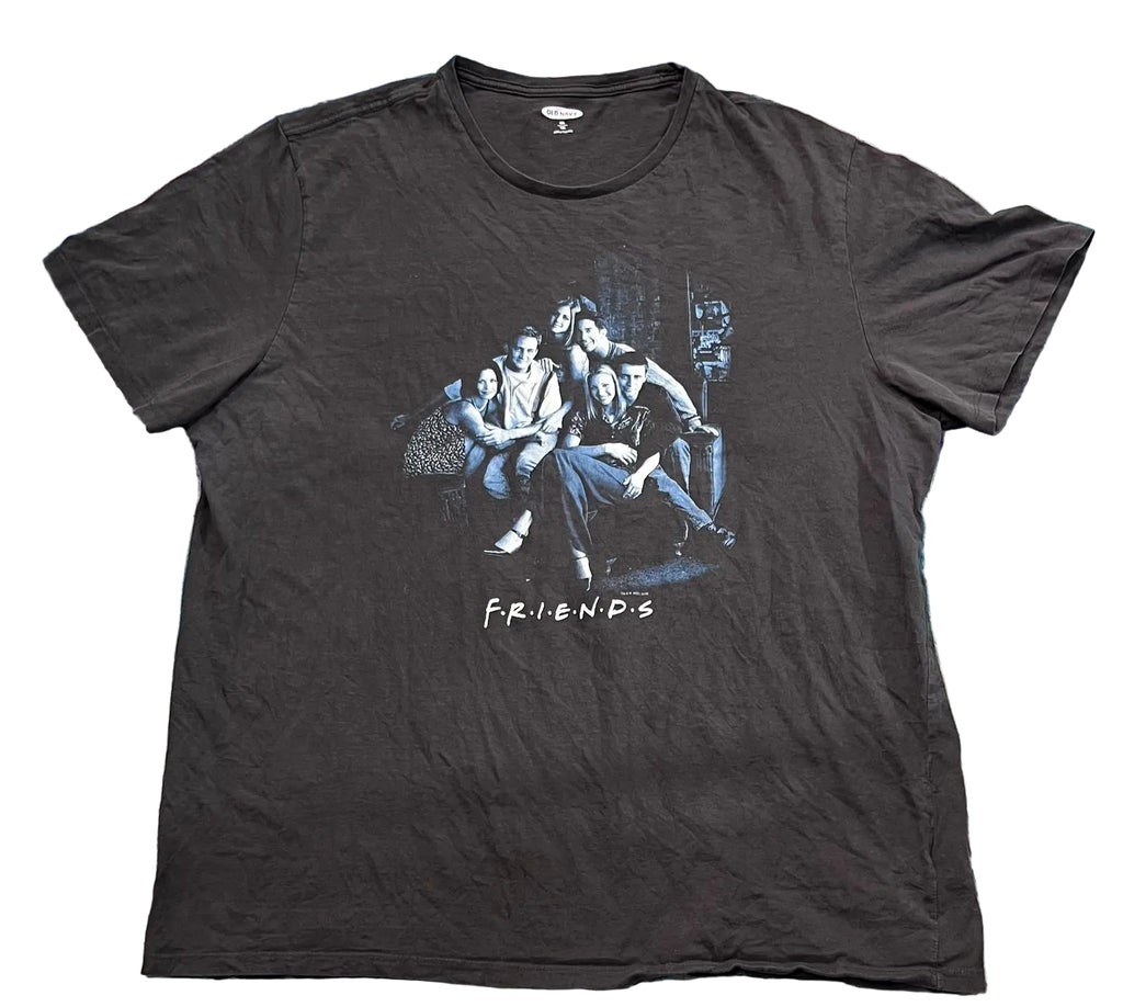 A black short-sleeve graphic t-shirt featuring the 'Friends' character group on the front with the 'FRIENDS' logo underneath