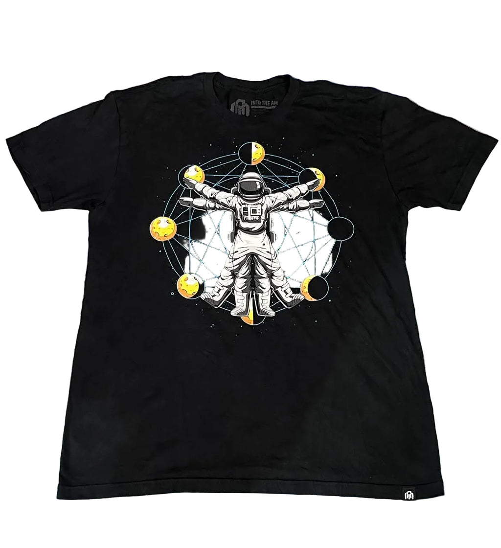 A black short-sleeve graphic t-shirt The graphic features an astronaut in a white spacesuit surrounded by yellow celestial bodies and a circular network.