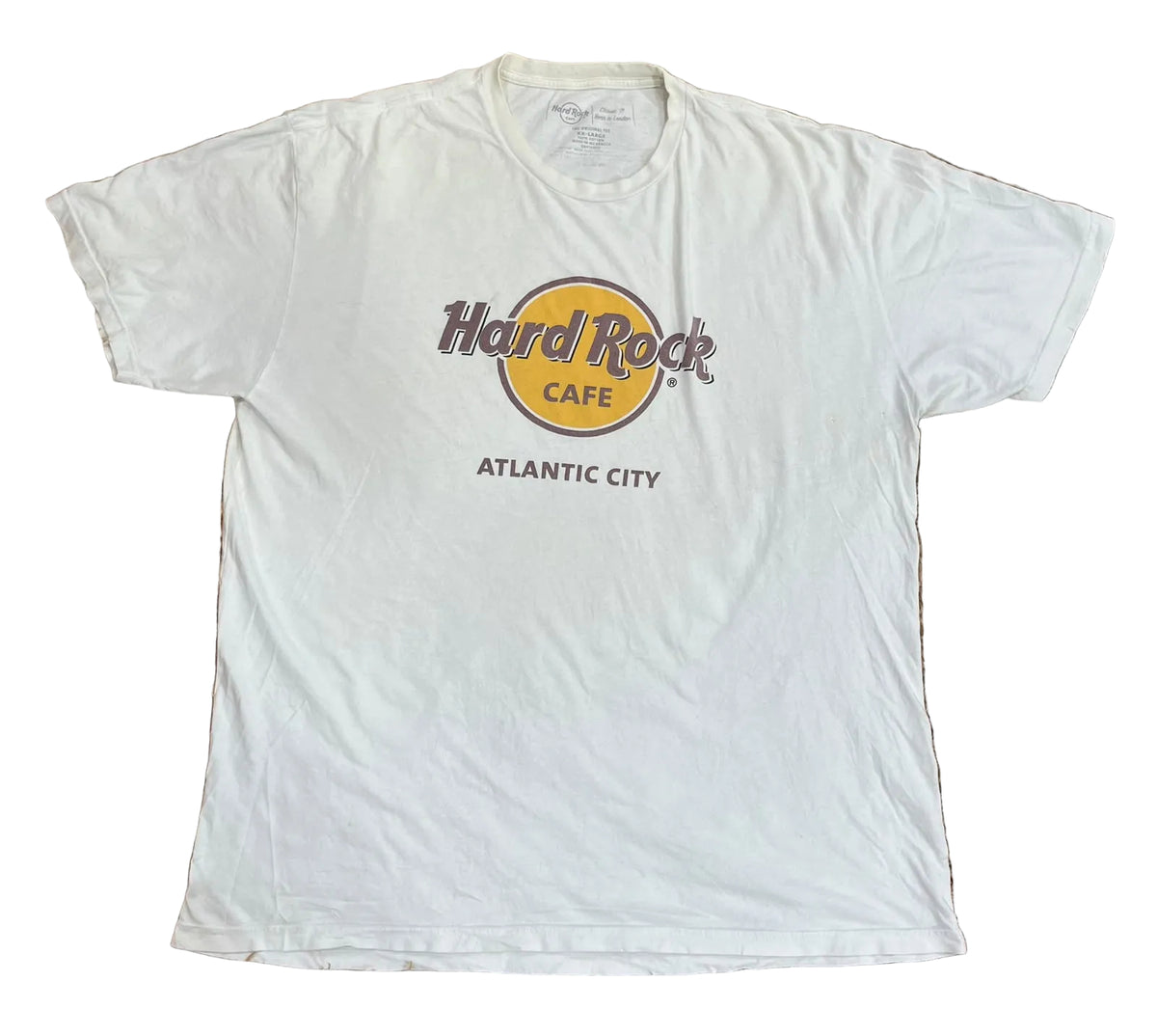A white short-sleeve t-shirt with a 'Hard Rock CAFE ATLANTIC CITY' graphic on the front,