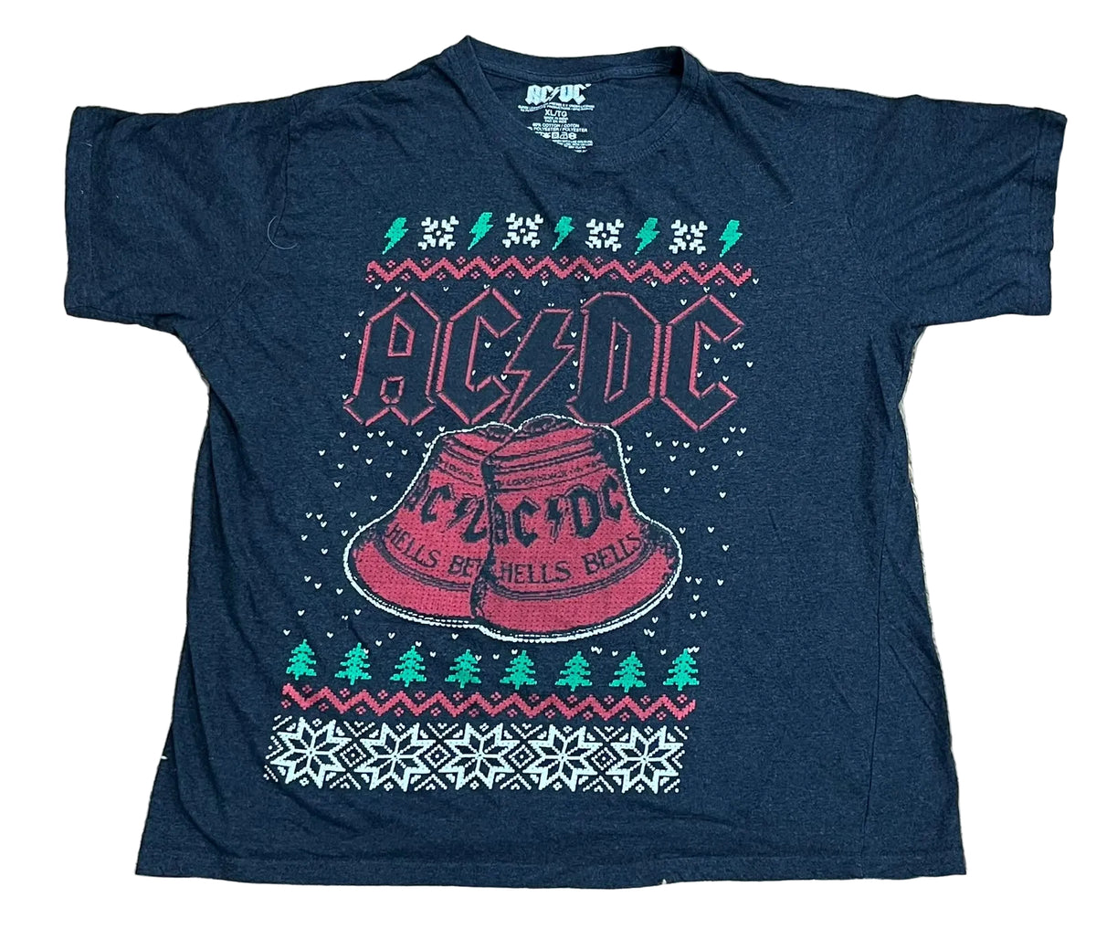 A navy blue AC/DC graphic t-shirt featuring a Christmas-themed design with a red fuzzy hat, green pine trees, and snowflake patterns, 