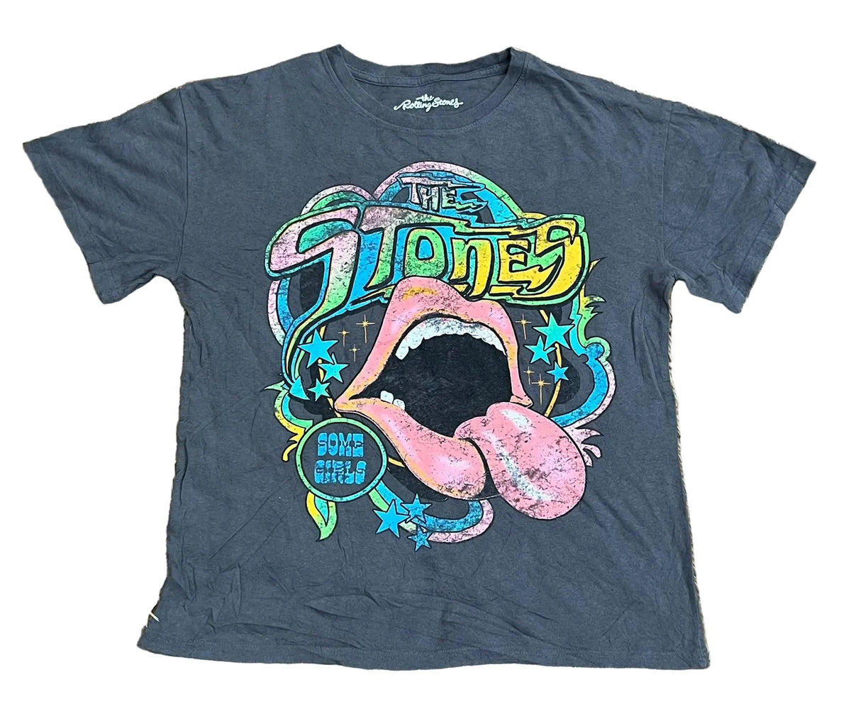 A dark gray graphic t-shirt featuring the 'The Stones' 'Love Is Rolling Shit' tongue-and-lips design, 