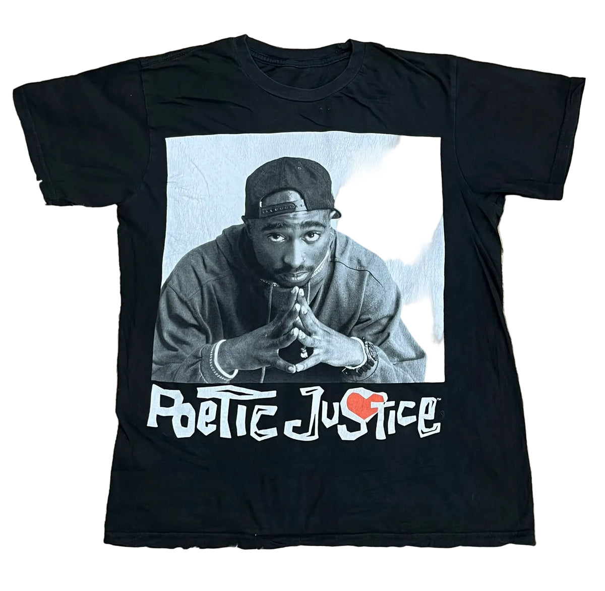 A black graphic t-shirt featuring a photo of Tupac Shakur and the text 'Poetic Justice' in white, 