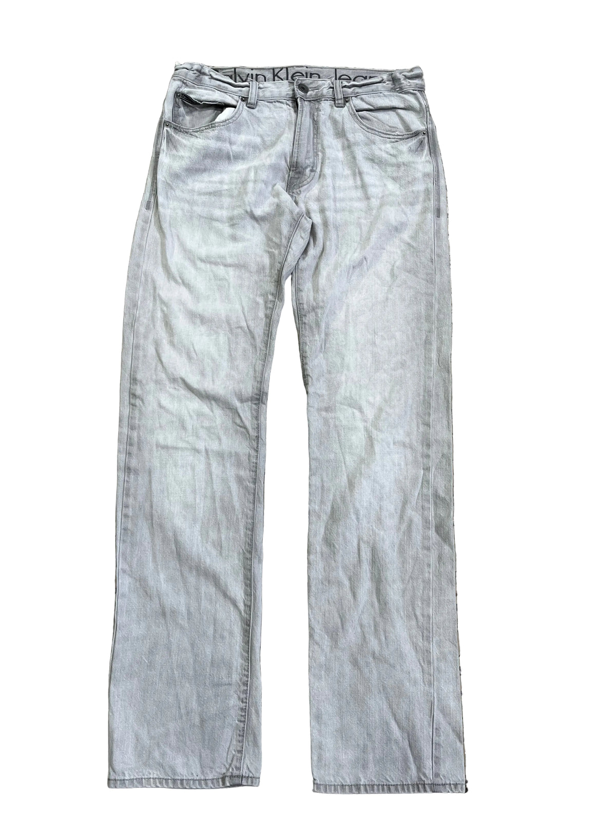 Light gray washed denim jeans on the white background