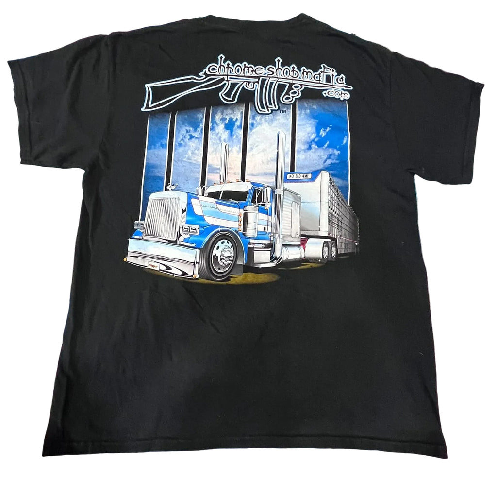 A black short-sleeve graphic t-shirt . The shirt features a large back graphic of a blue and white semi-truck under a white stylized 'Chainsaw Builders' logo.
