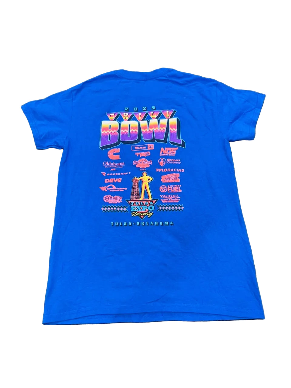 A bright blue short-sleeve t-shirt  featuring a large retro-style '2024 Bowl' graphic on the back with multiple colorful sponsor logos and a trophy illustration.