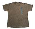 A brown short-sleeve t-shirt with a vertical graphic on the left chest reading 'FULL MGS' in blue and white,  A person's bare feet are visible at the bottom edge.