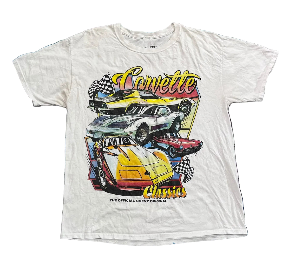 A white vintage graphic t-shirt featuring multiple Corvette cars and the text 'Corvette' and 'Chassis' in yellow, 