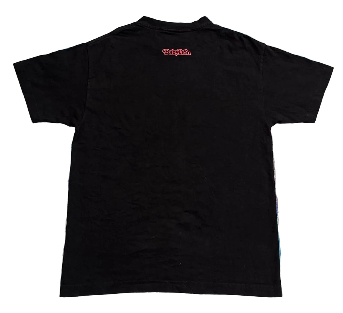 A black short-sleeve t-shirt . The shirt features a small red 'The Alchemist' logo printed on the upper back.