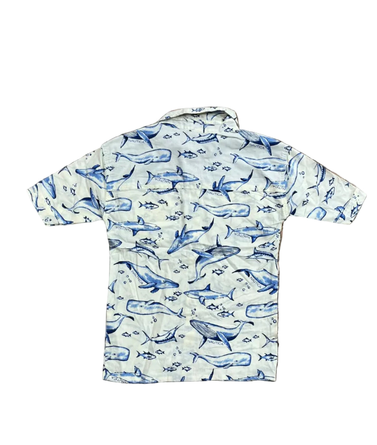 A baby long-sleeve bodysuit , featuring a blue whale and fish pattern on a cream-colored fabric. A baby's bare feet are visible at the top edge of the frame.