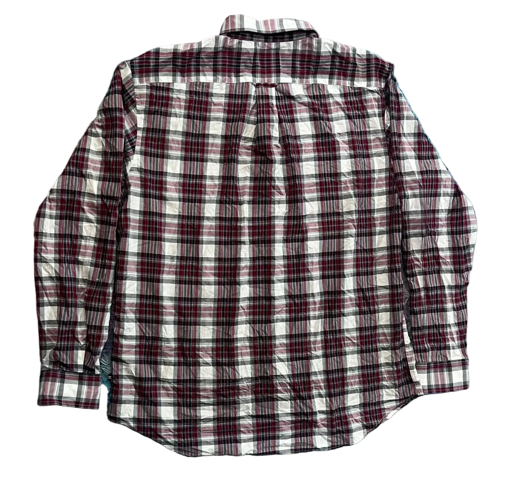 A long-sleeve plaid flannel shirt  The shirt features a white base with a dark red and black plaid pattern.