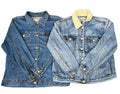 Two denim jackets. The left jacket is a medium wash blue denim with silver buttons.