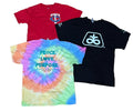 Three vintage graphic t-shirts a red Minnesota Twins shirt, a black Oreo shirt, and a multicolor tie-dye shirt with 'PEACE LOVE PURPOSE' printed on the back.