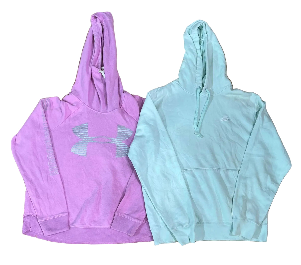 Two hooded sweatshirts  a lavender-purple Under Armour hoodie with a large gray logo on the front, and a light mint green Nike hoodie with a small white logo on the chest.