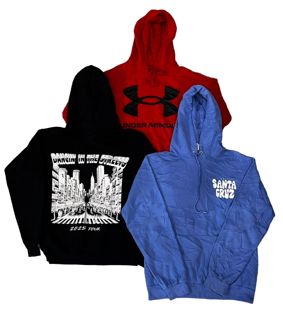 Three hoodies a black hoodie with a large white city graphic and text, a red Under Armour hoodie, and a blue hoodie with white 'Santa Cruz' text on the chest.